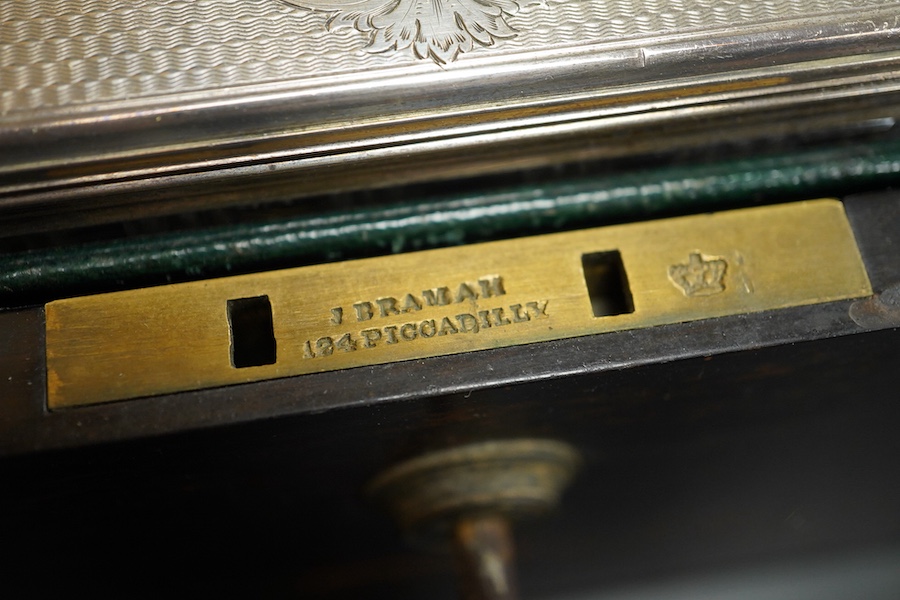 A Victorian brass mounted coromandel wood travelling toilet box, containing nine engine turned silver mounted cut glass toilet jars, with engraved initial, Brownett & Rose, London, 1870, the box of square form, with inse
